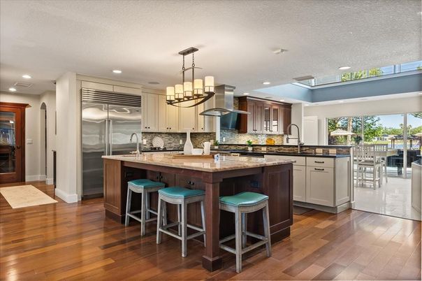 Chandelier, Interior, Kitchen, Pendant Lights, Recessed Lighting, Stainless Steel Appliances, Wood Texture Flooring