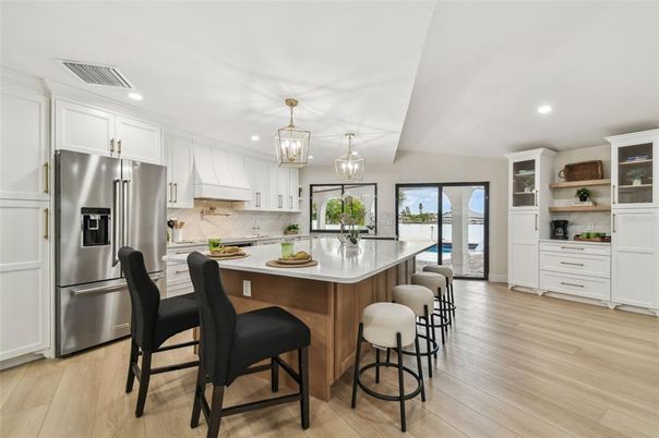 Chandelier, Interior, Kitchen, Pendant Lights, Recessed Lighting, Stainless Steel Appliances, Wood Texture Flooring