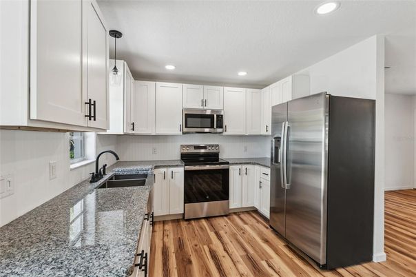 Interior, Kitchen, Pendant Lights, Recessed Lighting, Stainless Steel Appliances, Wood Texture Flooring