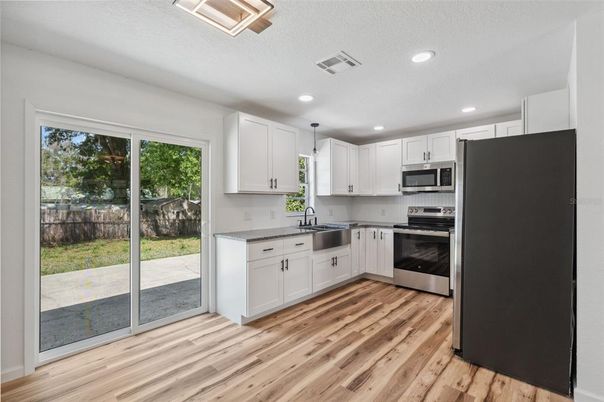 Interior, Kitchen, Recessed Lighting, Stainless Steel Appliances, Wood Texture Flooring
