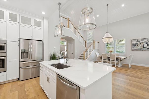 Chandelier, Dining room, Interior, Kitchen, Pendant Lights, Recessed Lighting, Stainless Steel Appliances, Wood Texture Flooring