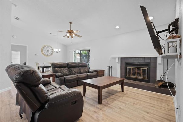 Dining room, Fireplace, Interior, Living room, Pendant Lights, Recessed Lighting, Wood Texture Flooring