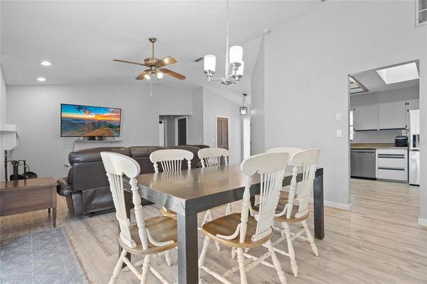 Dining room, Interior, Kitchen, Pendant Lights, Recessed Lighting, Stainless Steel Appliances, Wood Texture Flooring