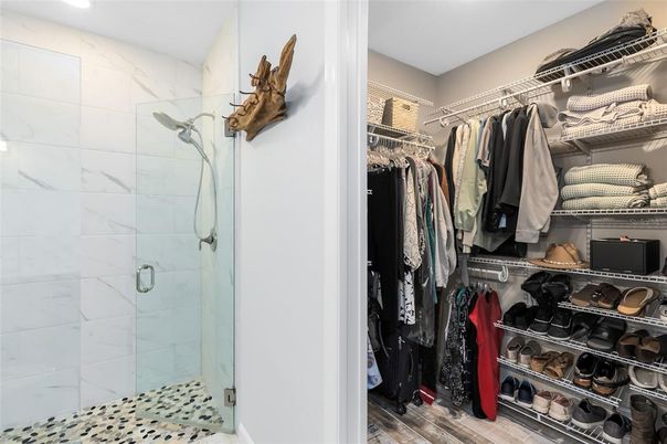 Bathroom, Glass Shower, Interior, Marble Walls, Recessed Lighting, Walk-in Closets, Wood Texture Flooring