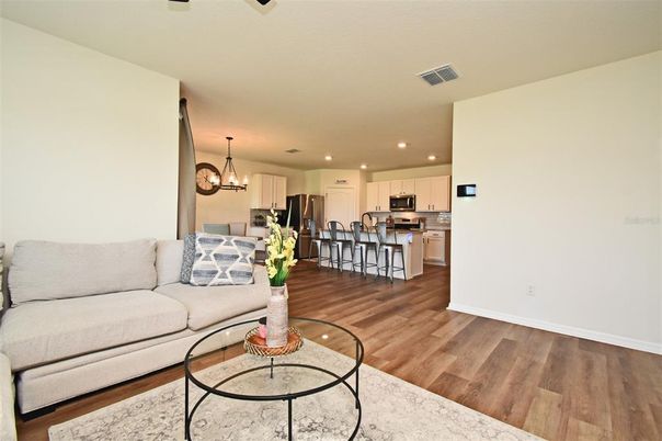 Chandelier, Interior, Kitchen, Living room, Recessed Lighting, Stainless Steel Appliances, Wood Texture Flooring