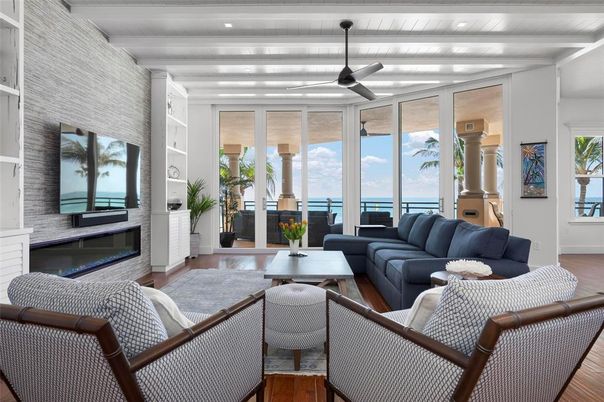 Fireplace, Interior, Living room, Recessed Lighting, Stone Walls, Water, Wood Texture Flooring