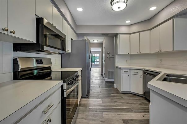 Interior, Kitchen, Recessed Lighting, Stainless Steel Appliances, Wood Texture Flooring