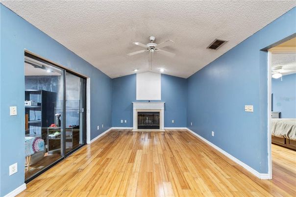 Bedroom, Empty room, Fireplace, Interior, Recessed Lighting, Wood Texture Flooring
