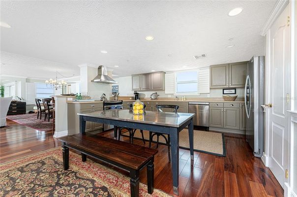 Chandelier, Dining room, Interior, Kitchen, Recessed Lighting, Stainless Steel Appliances, Wood Texture Flooring