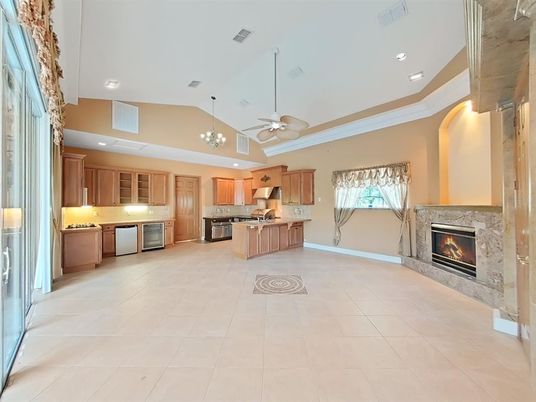 Chandelier, Fireplace, Interior, Kitchen, Recessed Lighting, Stainless Steel Appliances