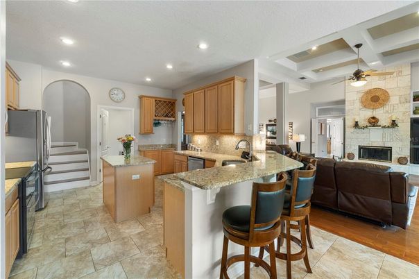 Fireplace, Interior, Kitchen, Living room, Recessed Lighting, Stone Walls, Wood Texture Flooring