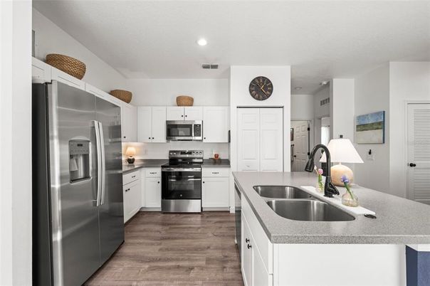 Dining room, Interior, Kitchen, Living room, Pendant Lights, Recessed Lighting, Stainless Steel Appliances, Wood Texture Flooring