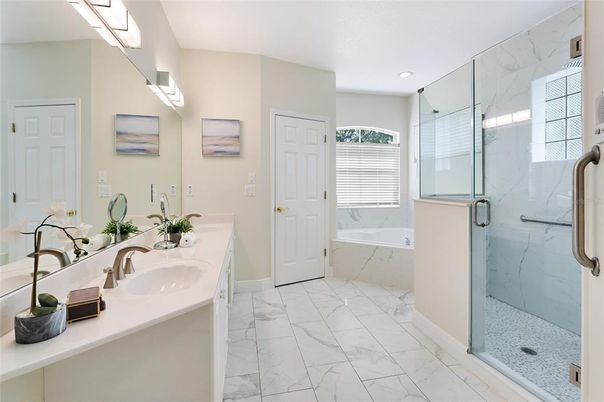 Bathroom, Dual Sink Vanities, Glass Shower, Interior, Marble, Marble Walls, Recessed Lighting