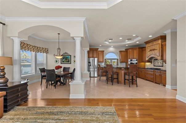 Dining room, Interior, Kitchen, Pendant Lights, Recessed Lighting, Stainless Steel Appliances, Wood Texture Flooring