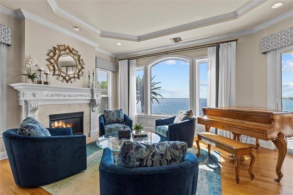 Fireplace, Interior, Living room, Piano, Recessed Lighting, Water, Wood Texture Flooring