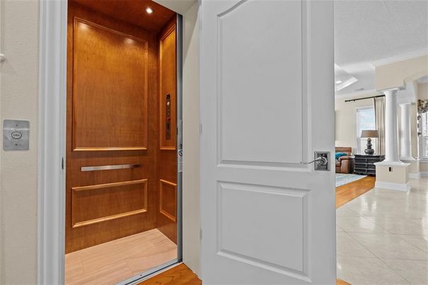 Elevator, Interior, Recessed Lighting, Wood Texture Flooring, Wooden Walls