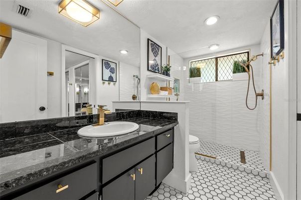 Bathroom, Dual Sink Vanities, Glass Shower, Interior, Recessed Lighting, Tile Countertops