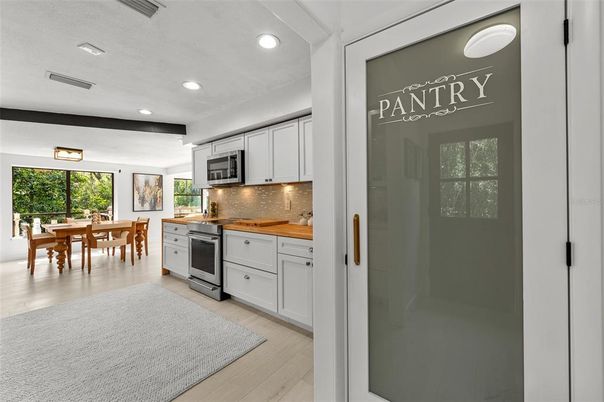 Dining room, Interior, Kitchen, Recessed Lighting, Stainless Steel Appliances, Wood Texture Flooring