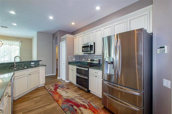 Interior, Kitchen, Recessed Lighting, Stainless Steel Appliances, Wood Texture Flooring