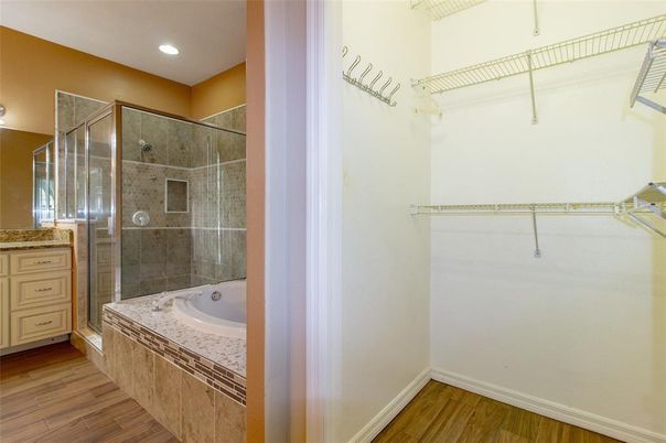 Bathroom, Glass Shower, Interior, Recessed Lighting, Walk-in Closets, Wood Texture Flooring