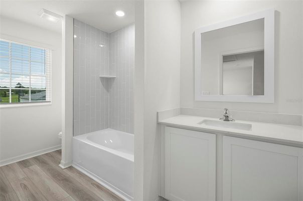 Bathroom, Dual Sink Vanities, Interior, Recessed Lighting, Wood Texture Flooring