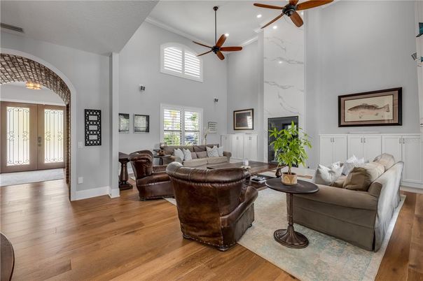 Fireplace, Interior, Living room, Marble Walls, Recessed Lighting, Wood Texture Flooring