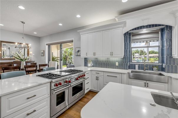 Chandelier, Dining room, Interior, Kitchen, Pendant Lights, Recessed Lighting, Stainless Steel Appliances, Wood Texture Flooring