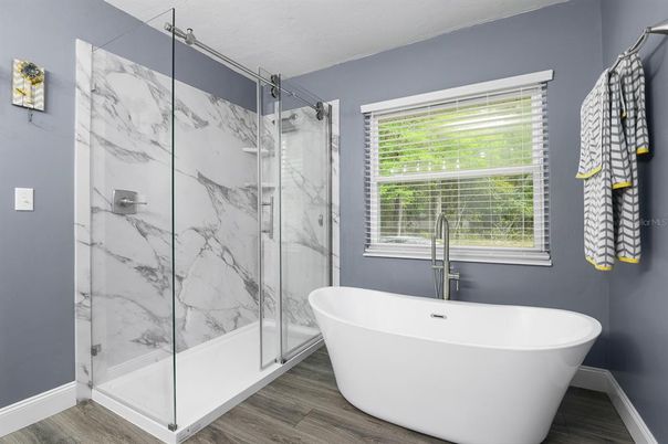 Bathroom, Free Standing Baths, Glass Shower, Interior, Marble Walls, Wood Texture Flooring
