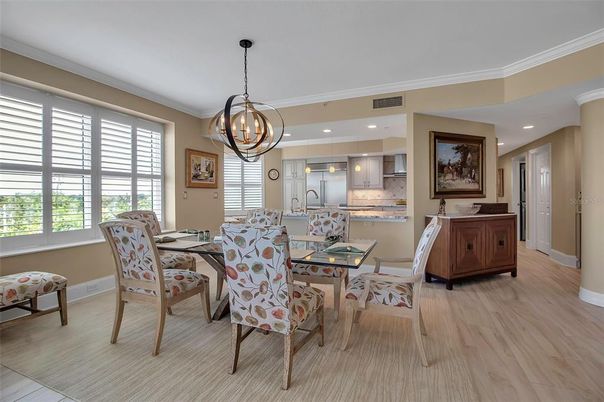 Chandelier, Dining room, Interior, Kitchen, Pendant Lights, Recessed Lighting, Stainless Steel Appliances, Wood Texture Flooring