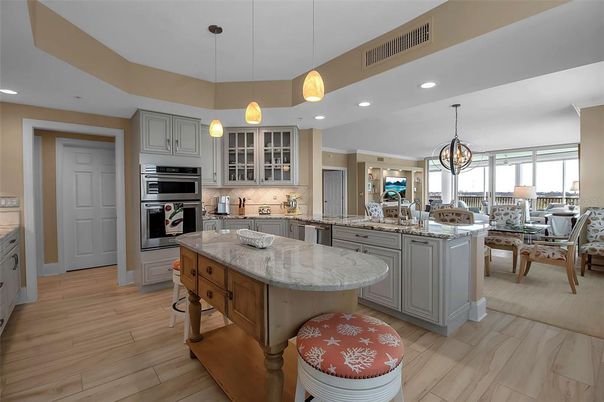 Chandelier, Dining room, Interior, Kitchen, Pendant Lights, Recessed Lighting, Stainless Steel Appliances, Wood Texture Flooring