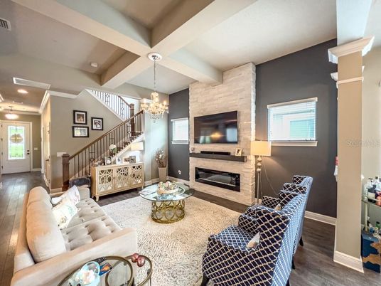 Chandelier, Fireplace, Interior, Living room, Recessed Lighting, Wood Texture Flooring