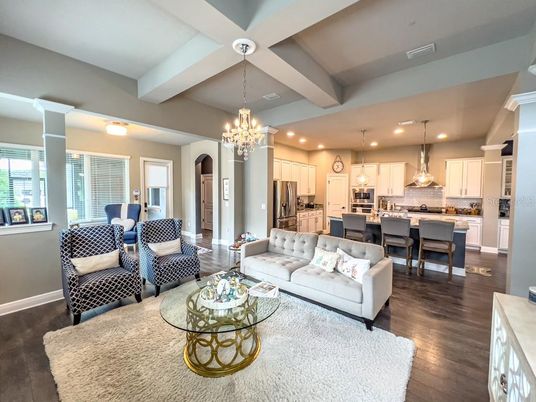 Chandelier, Dining room, Interior, Kitchen, Living room, Pendant Lights, Recessed Lighting, Stainless Steel Appliances, Wood Texture Flooring
