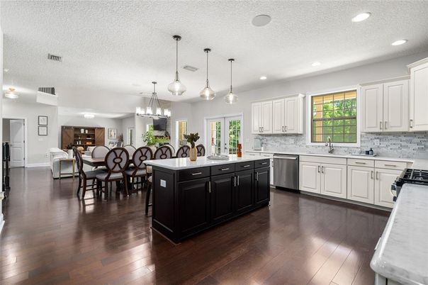 Dining room, Interior, Kitchen, Pendant Lights, Recessed Lighting, Stainless Steel Appliances, Wood Texture Flooring