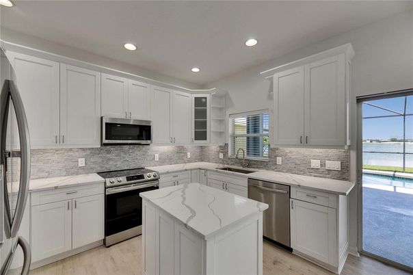 Interior, Kitchen, Recessed Lighting, Stainless Steel Appliances, Water, Wood Texture Flooring