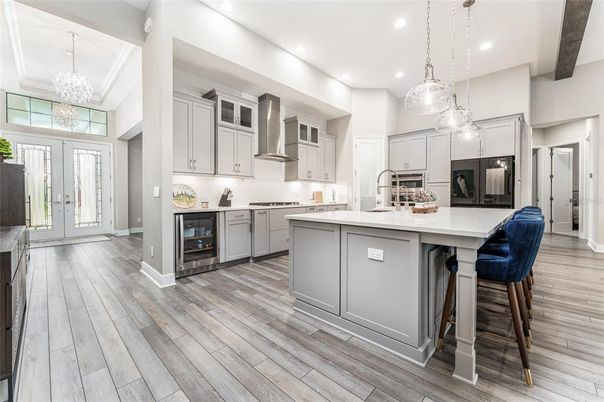 Chandelier, Interior, Kitchen, Pendant Lights, Recessed Lighting, Stainless Steel Appliances, Wood Texture Flooring