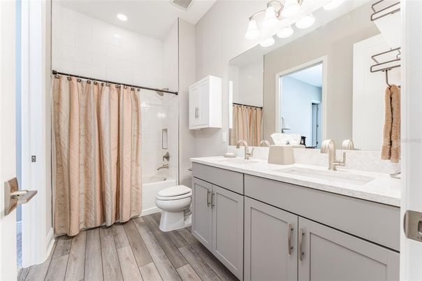 Bathroom, Dual Sink Vanities, Interior, Recessed Lighting, Wood Texture Flooring