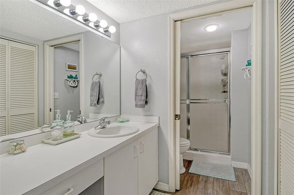 Bathroom, Dual Sink Vanities, Glass Shower, Interior, Wood Texture Flooring