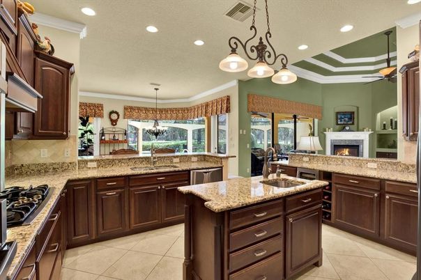 Chandelier, Fireplace, Interior, Kitchen, Pendant Lights, Recessed Lighting, Stainless Steel Appliances