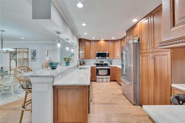Dining room, Interior, Kitchen, Pendant Lights, Recessed Lighting, Stainless Steel Appliances, Wood Texture Flooring
