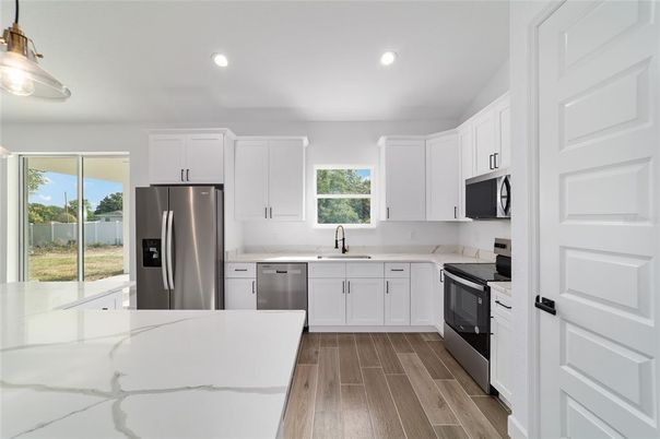 Interior, Kitchen, Recessed Lighting, Stainless Steel Appliances, Wood Texture Flooring