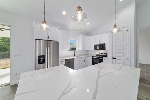 Interior, Kitchen, Pendant Lights, Recessed Lighting, Stainless Steel Appliances, Wood Texture Flooring