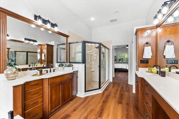 Bathroom, Dual Sink Vanities, Glass Shower, Interior, Recessed Lighting, Wood Texture Flooring