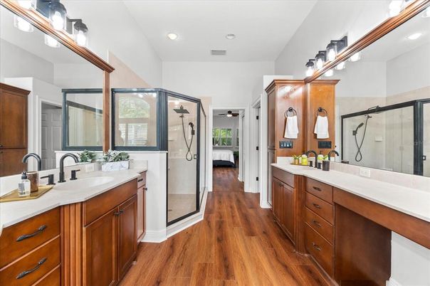 Bathroom, Dual Sink Vanities, Glass Shower, Interior, Recessed Lighting, Wood Texture Flooring