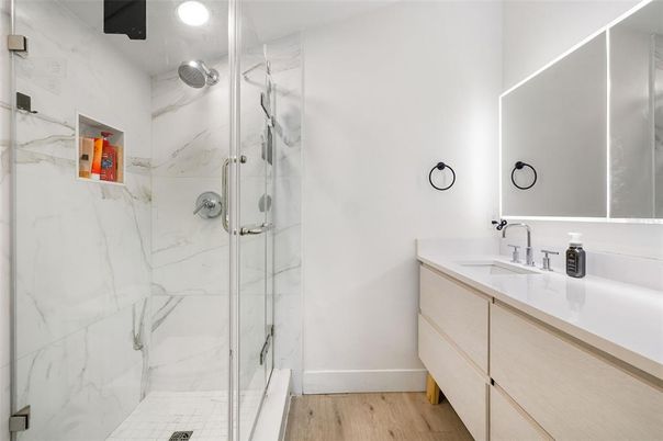 Bathroom, Glass Shower, Interior, Marble Walls, Recessed Lighting, Wood Texture Flooring