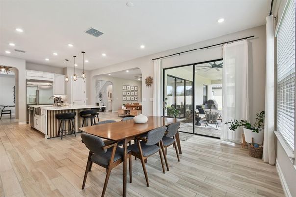 Dining room, Interior, Kitchen, Pendant Lights, Recessed Lighting, Stainless Steel Appliances, Wood Texture Flooring