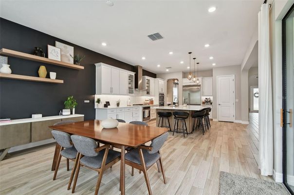Dining room, Interior, Kitchen, Pendant Lights, Recessed Lighting, Stainless Steel Appliances, Wood Texture Flooring