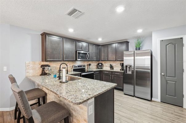Interior, Kitchen, Recessed Lighting, Stainless Steel Appliances, Wood Texture Flooring