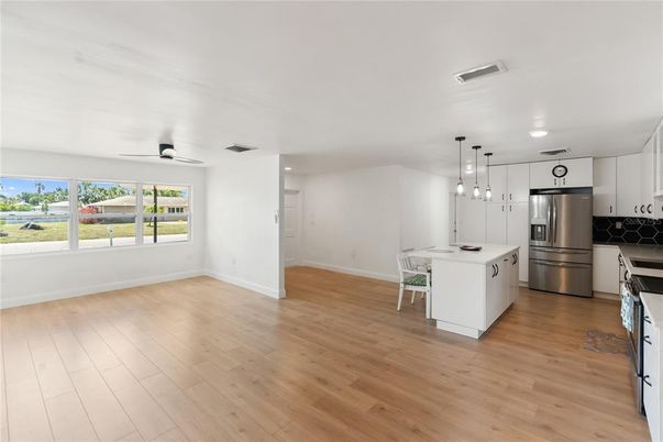 Dining room, Interior, Kitchen, Pendant Lights, Recessed Lighting, Stainless Steel Appliances, Wood Texture Flooring