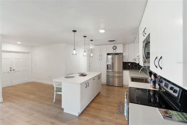 Interior, Kitchen, Pendant Lights, Recessed Lighting, Stainless Steel Appliances, Wood Texture Flooring
