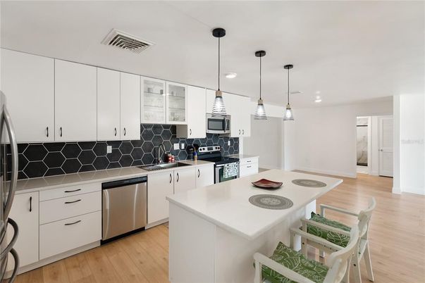 Interior, Kitchen, Pendant Lights, Recessed Lighting, Stainless Steel Appliances, Wood Texture Flooring